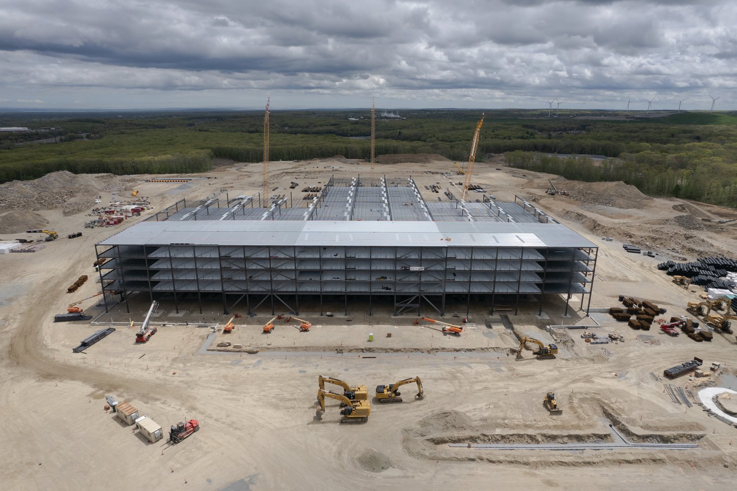 FROM THE AIR: These images of the Amazon construction site in Johnston were captured by drones piloted by Trevor Bryan, an FAA Licensed and insured drone pilot, the owner and operator of New England Aerial Services, on May 15. For more information on the Warwick-based company, visit their Facebook page at www.facebook.com/newenglandaerialservices.